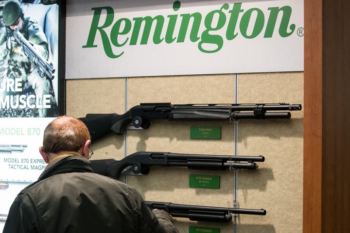 Rifles by the American manufacturer Remington are displayed at a trade show in Germany in 2018. Lawyers for the bankrupt company have offered $33 million to settle a lawsuit filed by victims of the 2012 Sandy Hook Elementary School shooting.