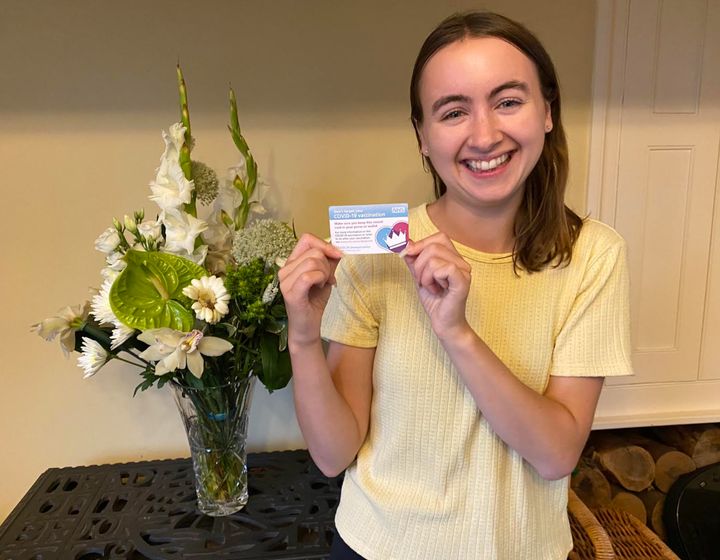 The author with her COVID-19 vaccination card in July.