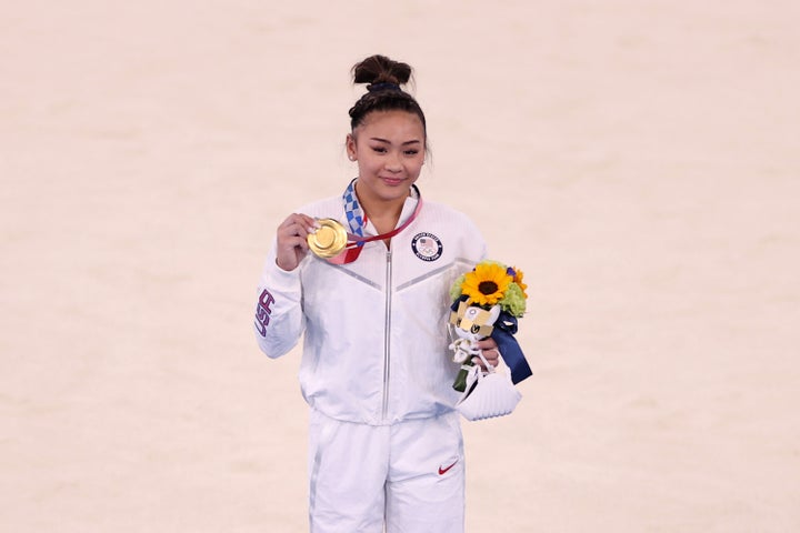Sunisa Lee of the U.S. poses with her gold medal after winning the women's all-around gymnastics final at the Tokyo Games on July 29.