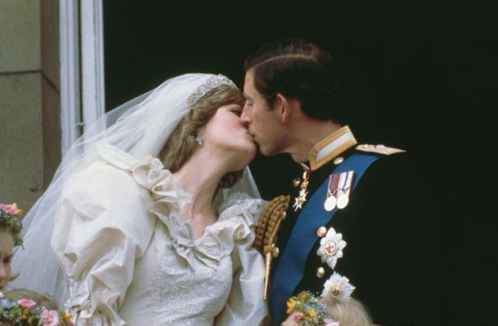 Prince Charles, Prince of Wales, kissing his wife, Princess Diana (1961 - 1997), on the balcony of Buckingham Palace in London after their wedding, 29th July 1981. (Photo by Keystone/Hulton Archive/Getty Images)