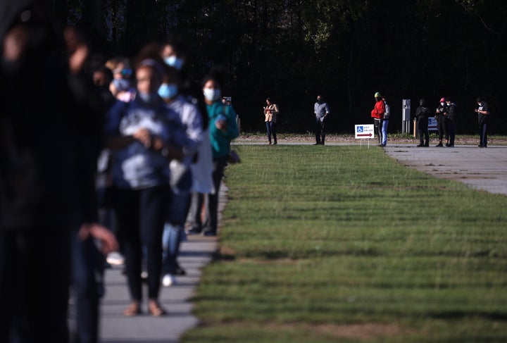 People line up to vote at the Gwinnett County Fairgrounds on Oct. 30, 2020, in Lawrenceville, Georgia.