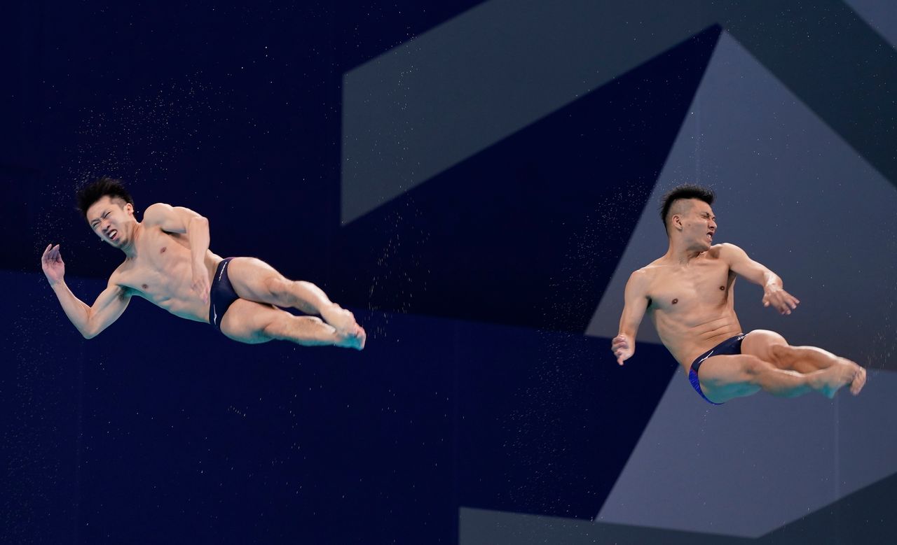 Jul 28, 2021; Tokyo, Japan; Sho Sakai and Ken Terauchi (JPN) in the men's 3m springboard synchronized diving competition during the Tokyo 2020 Olympic Summer Games at Tokyo Aquatics Centre. Mandatory Credit: Grace Hollars-USA TODAY Sports
