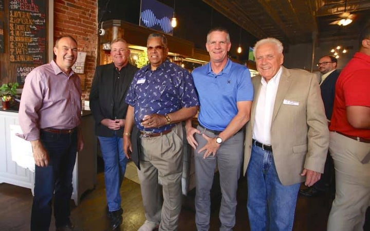 Ohio state Sen. Bob Peterson (left) chats with supporters at restaurant in Chillicothe on Wednesday. Peterson is betting that local endorsements will carry more weight than national ones.