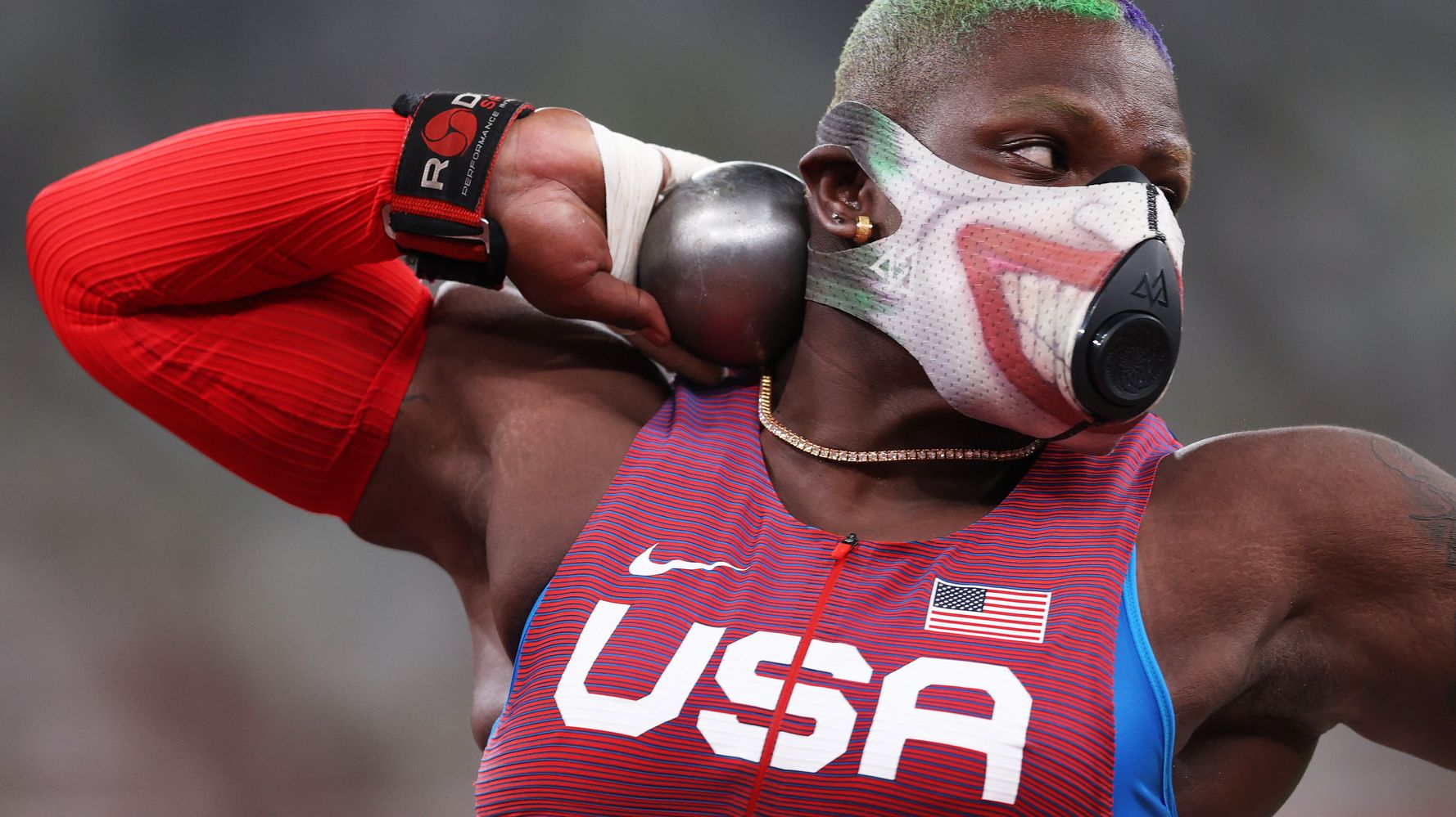U.S. Olympic Shot Putter’s Supervillain Face Mask Is No Joke