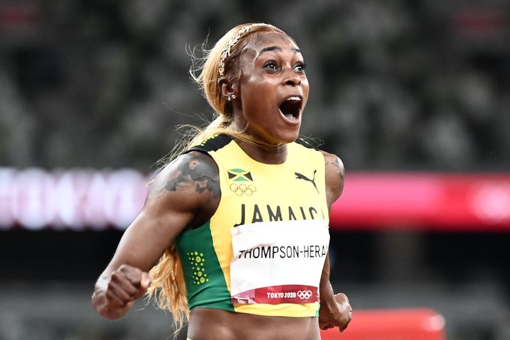 Jamaica's Elaine Thompson-Herah celebrates after her second straight Olympic 100-meter victory.