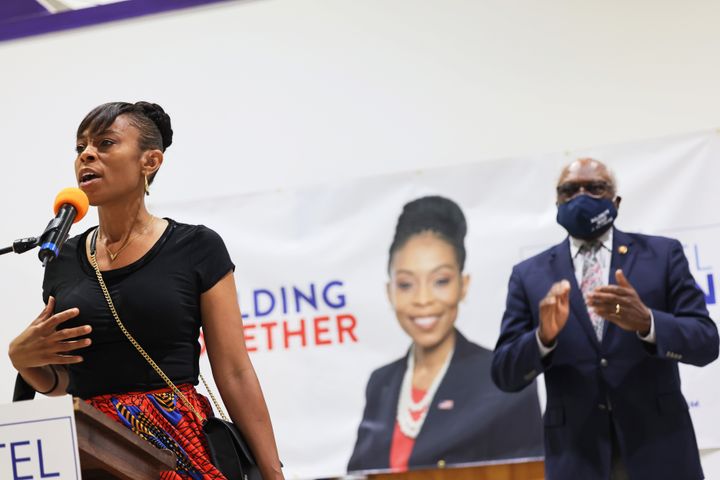 Shontel Brown, a Cuyahoga County councilwoman running for Congress, speaks to voters in Cleveland on Saturday as House Majority Whip James Clyburn looks on.