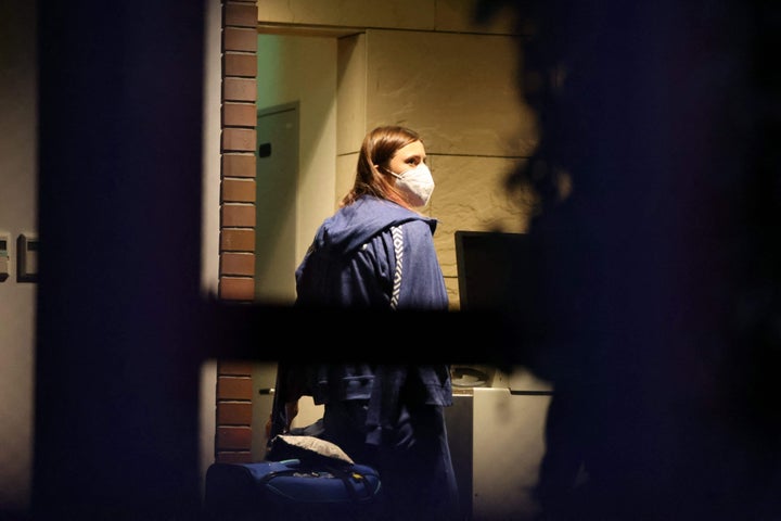 Belarus athlete Krystsina Tsimanouskaya walks with her luggage inside the Polish embassy in Tokyo on Aug. 2, 2021. 