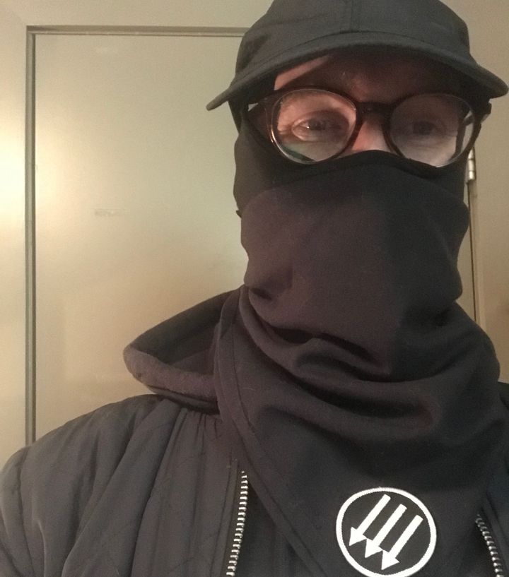 A photo of the author wearing his black bloc attire taken the night before he began serving his sentence at Rikers Island.