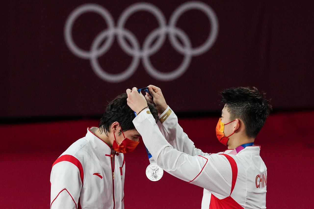 Silver medalists Li Junhui and Liu Yuchen of Team China are seen during the medal ceremony for the men's doubles badminton event on July 31.