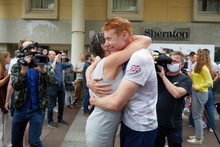 Tom Dean hugs his mother Jacquie Hughes.