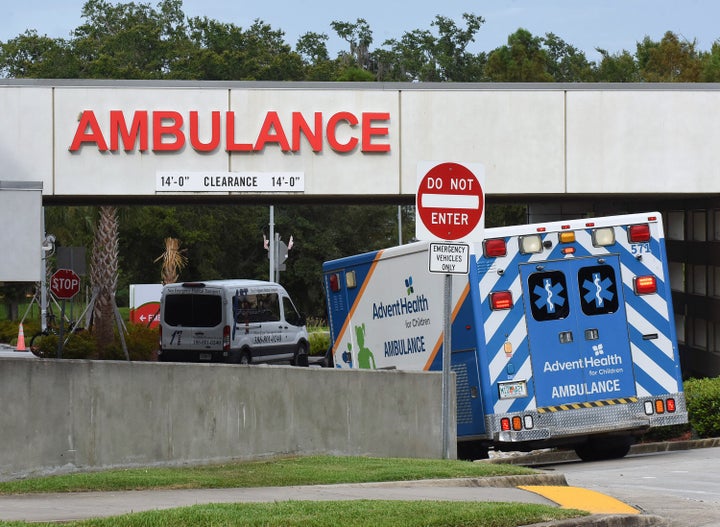 An ambulance arrives at the emergency department at AdventHealth hospital in Orlando on July 26, the day that hospital offici