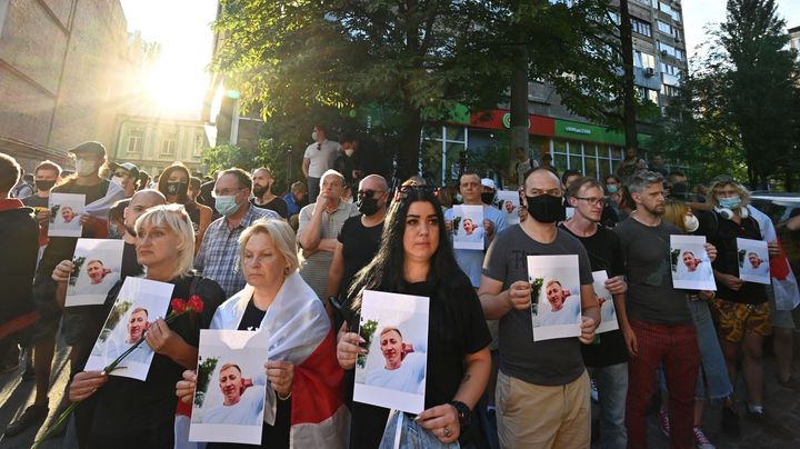 Activists attend a rally outside the Belarus embassy in Kiev on August 3, 2021, in memory of Vitaly Shishov. (Photo by SERGEI SUPINSKY/AFP via Getty Images)