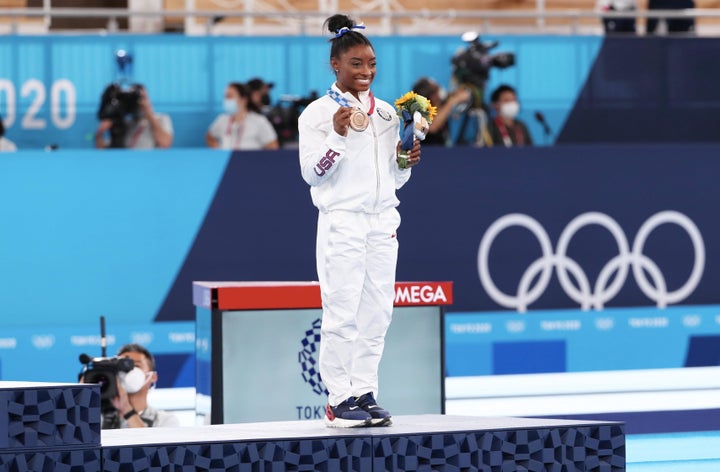 Simone Biles celebrates her bronze medal after the Women's balance beam final on Aug. 3, 2021, in Tokyo.