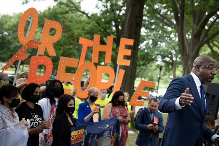 U.S. Sen. Raphael Warnock (D-Ga.) speaks to people rallying for voters' rights on Capitol Hill on Aug. 3, 2021.