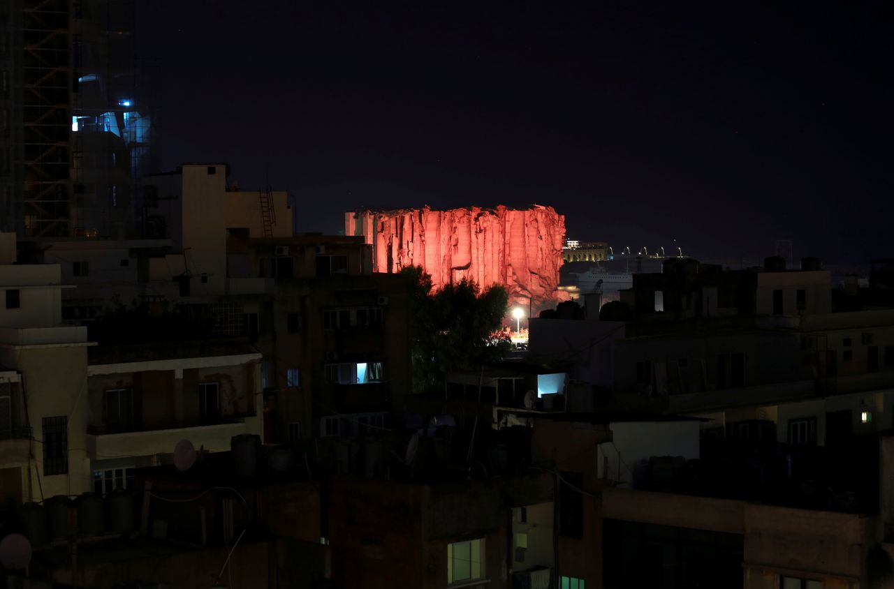 Lebanon marks one year anniversary of Beirut port explosion by lighting up a damaged building.