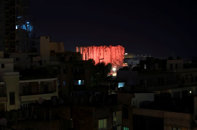 Lebanon marks one year anniversary of Beirut port explosion by lighting up a damaged building.