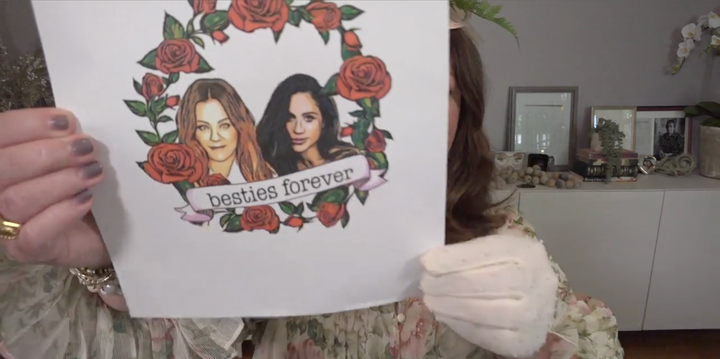 McCarthy shows Meghan the mockup of a tattoo in the duchess's 40x40 announcement video.