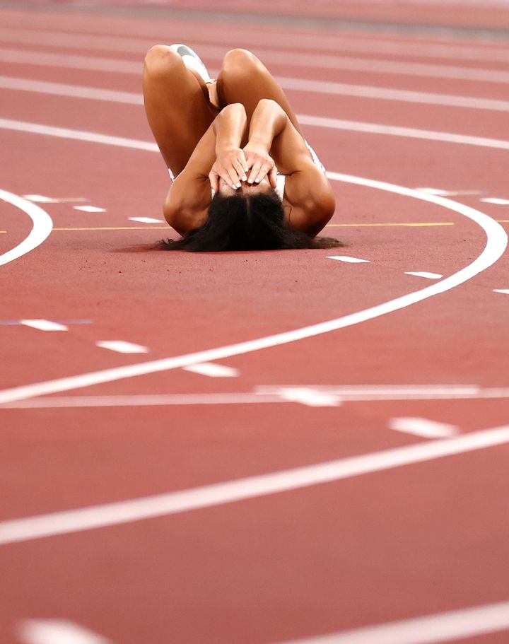 Johnson-Thompson reacts after falling down in the 200m
