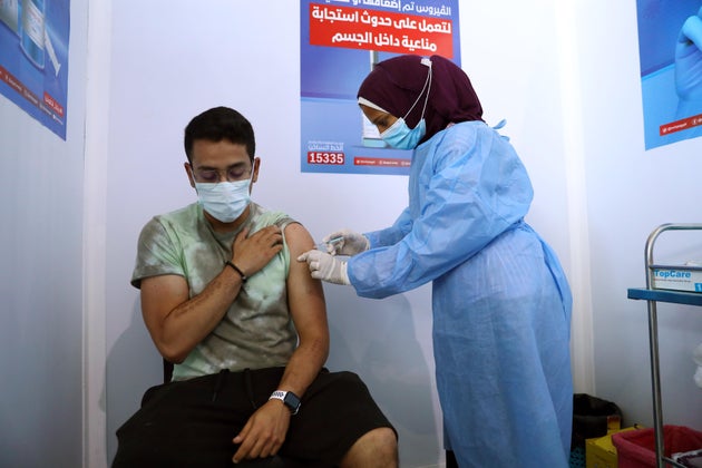 A man receives the COVID-19 vaccine at a mass vaccination venue in Cairo, Egypt. 