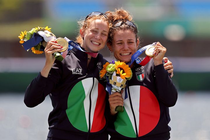 Italian gold medalists Valentina Rodini and Federica Cesarini with the bouquets following their victory in the women's lightweight double sculls.