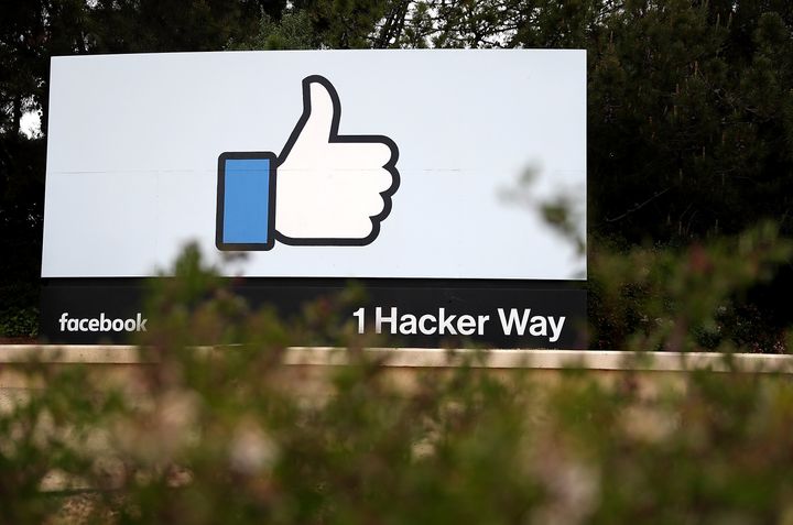 A sign is posted outside of Facebook headquarters in Menlo Park, California. NYU academics say the company is attempting to exert control on research that paints it in a negative light.