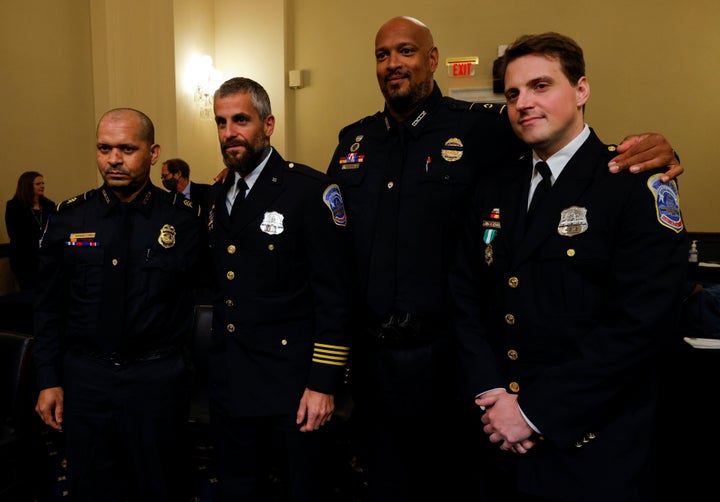 U.S. Capitol Police Sgt. Aquilino Gonell, Metropolitan Police Department Officer Michael Fanone, U.S. Capitol Police Officer Harry Dunn and Metropolitan Police Officer Daniel Hodges stand together on July 27 following the opening hearing of the House select committee investigating the Jan. 6 attack on the U.S. Capitol.