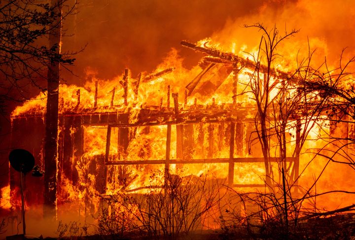 A home is engulfed in flames as the Dixie fire rages on in Greenville, California on August 5, 2021.