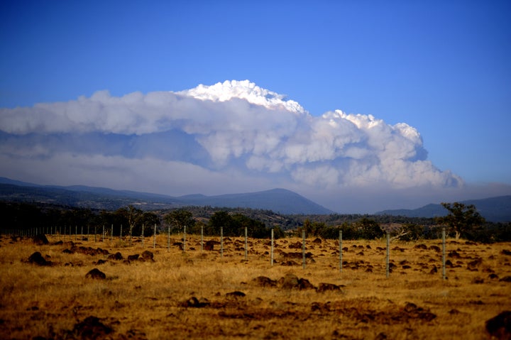 Smoke plume is seen from highway 36 leading into Chester and Lake Almanor during Dixie Fire near Chico in Greenville, California, United States on August 5, 2021.