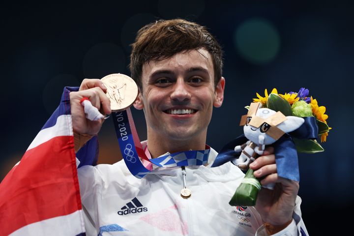 Bronze medalist Tom Daley of Team Great Britain poses after the medal ceremony for the Men's 10m Platform