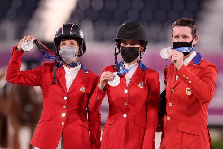 Laura Kraut, Jessica Springsteen and McLain Ward pose with their silver medals.