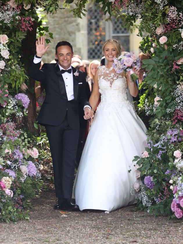 The newlyweds beamed as they left the