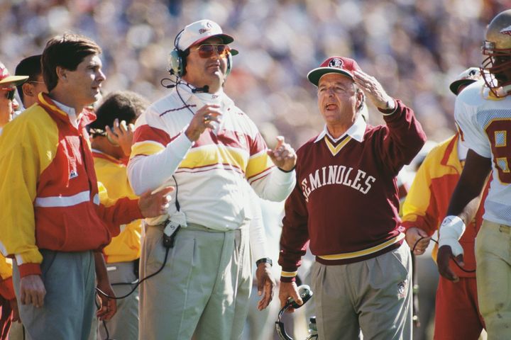 Bobby Bowden, Head Coach for the Florida State Seminoles ( right ) with Brad Scott his offensive coordinator on the sideline during the NCAA Division I-A Independent college football game against the University of Michigan Wolverines on 28th September 1991 at the Michigan Stadium in Ann Arbor, Michigan, United States. (Photo by Damien Strohmeyer/Allsport/Getty Images)