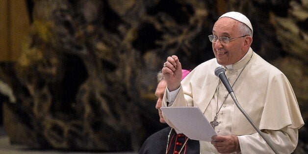 Pope Francis delivers a speech during the private Audience to the Accountants and Accounting Experts, in Aula Paolo VI at the Vatican on November 14, 2014. AFP PHOTO / ANDREAS SOLARO (Photo credit should read ANDREAS SOLARO/AFP/Getty Images)