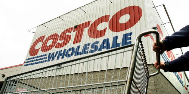 FILE - A shopper pushes a cart outside Costco Wholesale in Danvers, Mass. in this May 27, 2009 file photo. Costco's fiscal second-quarter net income fell 15 percent, hurt by softer sales of some non-food items, weaker gross margins in its fresh foods business and the impact of weaker foreign currency exchange rates on its international results. Its latest performance missed Wall Street's view. The stock declined in premarket trading on Thursday March 6, 2014. (AP Photo/Elise Amendola, File)