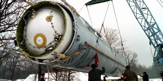 FILE - In this Wednesday, Dec. 24, 1997 file photo, soldiers prepare to destroy a ballistic SS-19 missile in the yard of the largest former Soviet military rocket base in Vakulenchuk, Ukraine, 220 kilometers (137 miles) west of Kiev. The U.S. helped Ukraine and other ex-Soviet nations secure former Soviet nuclear weapons and dismantle some of them under the Cooperative Threat Reduction Program initiated by Sens. Sam Nunn and Richard Lugar. (AP Photo, File)