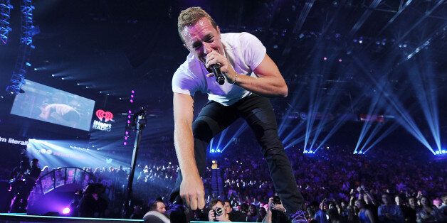 LAS VEGAS, NV - SEPTEMBER 19: Musician Chris Martin of Coldplay performs onstage during the 2014 iHeartRadio Music Festival at the MGM Grand Garden Arena on September 19, 2014 in Las Vegas, Nevada. (Photo by Denise Truscello/WireImage)