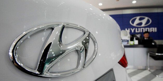 The logo of Hyundai Motor Co is seen on a car displayed at a showroom in Seoul, South Korea, Thursday, Jan. 26, 2012. Hyundai Motor Co. said its 2011 earnings reached a record high on increased demand at home and abroad. (AP Photo/Ahnn Young-joon)