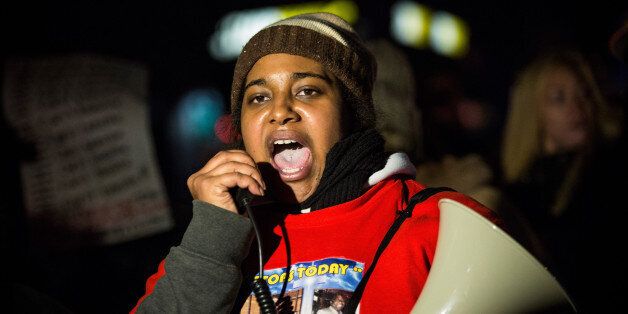 NEW YORK, NY - DECEMBER 11: Erica Garner, daughter of Eric Garner, leads a march of people protesting the Staten Island, New York grand jury's decision not to indict a police officer involved in the chokehold death of Eric Garner in July, on December 11, 2014 in the Staten Island Neighborhood of New York City. Protests have continued throughout the country since the Grand Jury's decision was announced last week. (Photo by Andrew Burton/Getty Images)