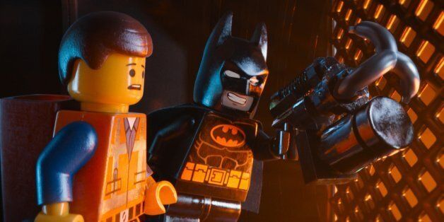 This image released by Warner Bros. Pictures shows characters Emmet, voiced by Chris Pratt, left, and Batman, voiced by Will Arnett, in a scene from "The Lego Movie." (AP Photo/Warner Bros. Pictures)