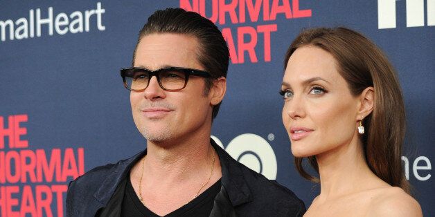 Brad Pitt and Angelina Jolie attend the premiere of HBO Films' "The Normal Heart" at the Ziegfeld Theatre on Monday, May 12, 2014, in New York. (Photo by Evan Agostini/Invision/AP)