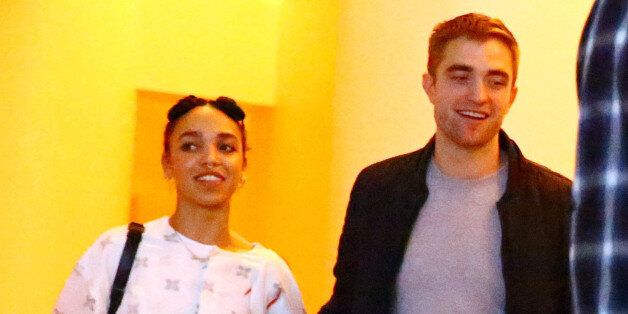 MIAMI, FL - DECEMBER 04: (L-R) Singer FKA Twigs and Robert Pattinson attend a Surface Magazine Event With Hans Ulrich Obrist And FKA Twigs at Edition Hotel on December 4, 2014 in Miami, Florida. (Photo by Astrid Stawiarz/Getty Images for Surface)