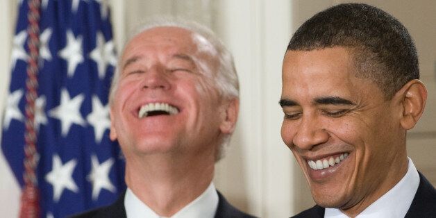 US President Barack Obama (R) laughs alongside US Vice President Joe Biden prior to signing the healthcare insurance reform legislation during a ceremony in the East Room of the White House in Washington, DC, March 23, 2010. Obama Tuesday signed into law sweeping reforms that will for the first time ensure health care coverage for almost every American. AFP PHOTO / Saul LOEB (Photo credit should read SAUL LOEB/AFP/Getty Images)