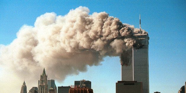 NEW YORK - SEPTEMBER 11, 2001: (SEPTEMBER 11 RETROSPECTIVE) Smoke pours from the twin towers of the World Trade Center after they were hit by two hijacked airliners in a terrorist attack September 11, 2001 in New York City. (Photo by Robert Giroux/Getty Images)