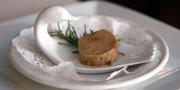 FILE - In this Wednesday, Aug. 9, 2006 file photo, a serving of salt-cured fresh foie gras with herbs is displayed at Chef Didier Durand's Cyrano's Bistrot and Wine Bar in Chicago. Foie gras lovers are rejoicing after a federal judge in Los Angeles blocked Californiaâs ban on the sale of the fatty duck and goose liver. Judge Stephen V. Wilson on Wednesday, Jan. 7, 2015 permanently blocked the state attorney general from enforcing the law, which took effect two years ago. (AP Photo/M. Spencer Green)