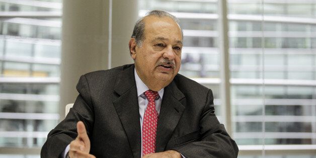 Carlos Slim, the Mexican telecommunications billionaire, speaks during an interview in New York, U.S., on Tuesday, Oct. 7, 2014. Slim, the world's second-richest person, said America Movil SAB may divest assets beyond the eastern coast of Mexico as the company pursues a breakup to comply with new laws. Photographer: Chris Goodney/Bloomberg via Getty Images 