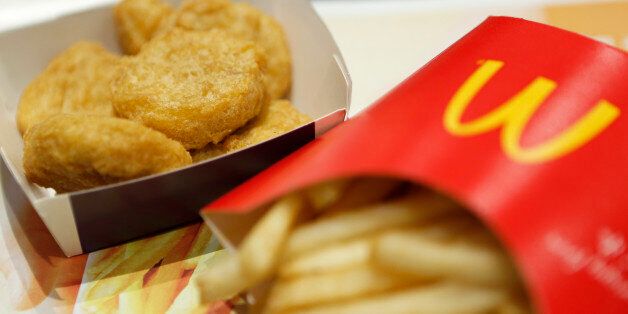 A box of chicken nuggets, left, sits beside a portion of french fries in this arranged photograph at a McDonald's restaurant, operated by McDonald's Holdings Co. Japan Ltd., in Tokyo, Japan, on Wednesday, Jan.7, 2015. McDonald's Corp.'s Japan business and Cargill Inc. are investigating complaints objects were found in chicken nuggets made by a Cargill factory in Thailand, the restaurant chainÃ¢s second food safety crisis in six months. Photographer: Kiyoshi Ota/Bloomberg via Getty Images