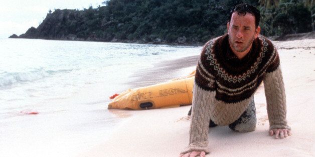 Tom Hanks washed up on the beach of an island in a scene from the film 'Cast Away', 2000. (Photo by 20th Century-Fox/Getty Images)