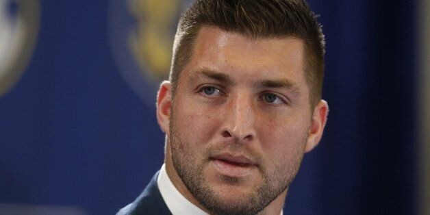 FILE - In this Dec. 5, 2014, file photo, Tim Tebow speaks during an SEC television broadcast in Atlanta. Tebow worked out Monday, March 16, 2015, for the Philadelphia Eagles, a person familiar with the session tells The Associated Press. The person spoke on condition of anonymity because the workout was not made public. (AP Photo/Brynn Anderson, File)