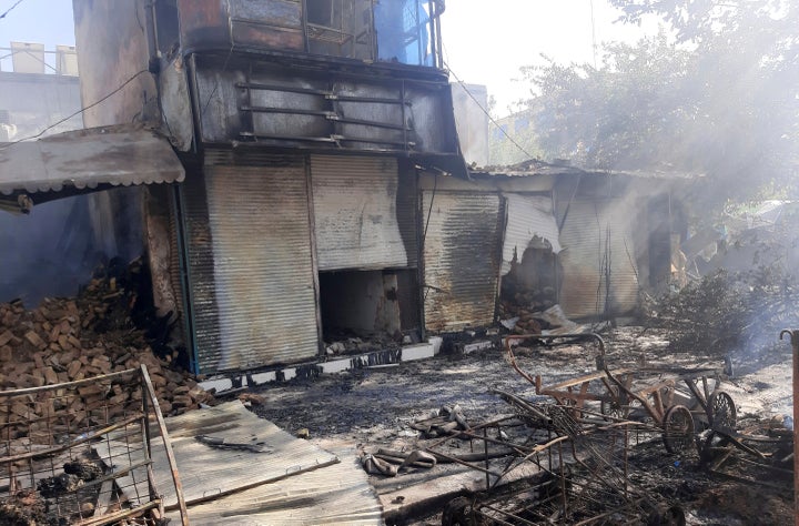 Smoke rises from damaged shops after fighting between Taliban and Afghan security forces in Kunduz city, northern Afghanistan, on Aug. 8, 2021.