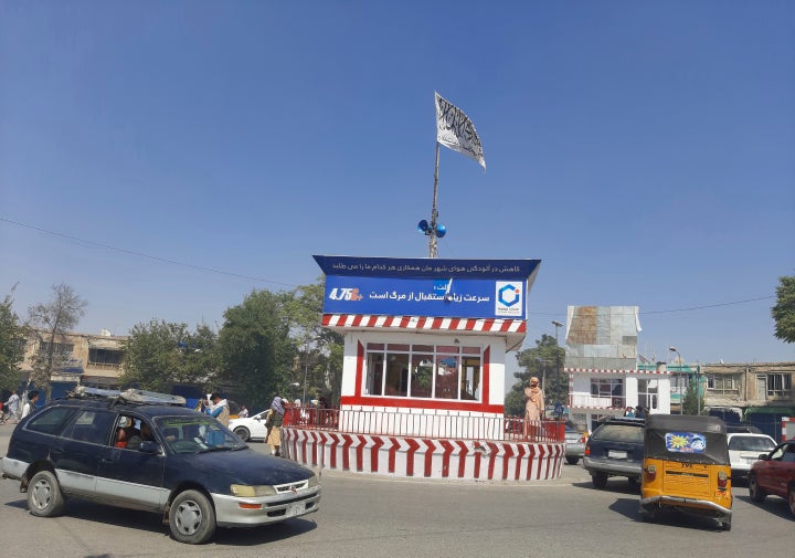 A Taliban flag flies in the main square of Kunduz city after fighting between Taliban and Afghan security forces, in Kunduz, Afghanistan, on Aug. 8, 2021. 